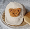 Beigefarbene Baby-/Kindermütze aus Kord mit Teddybär